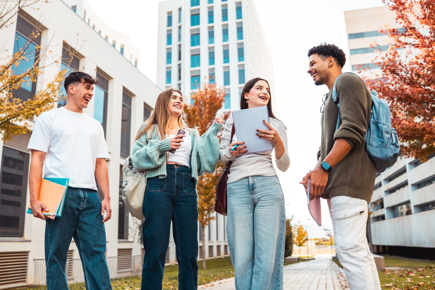 College students talking together outside on campus